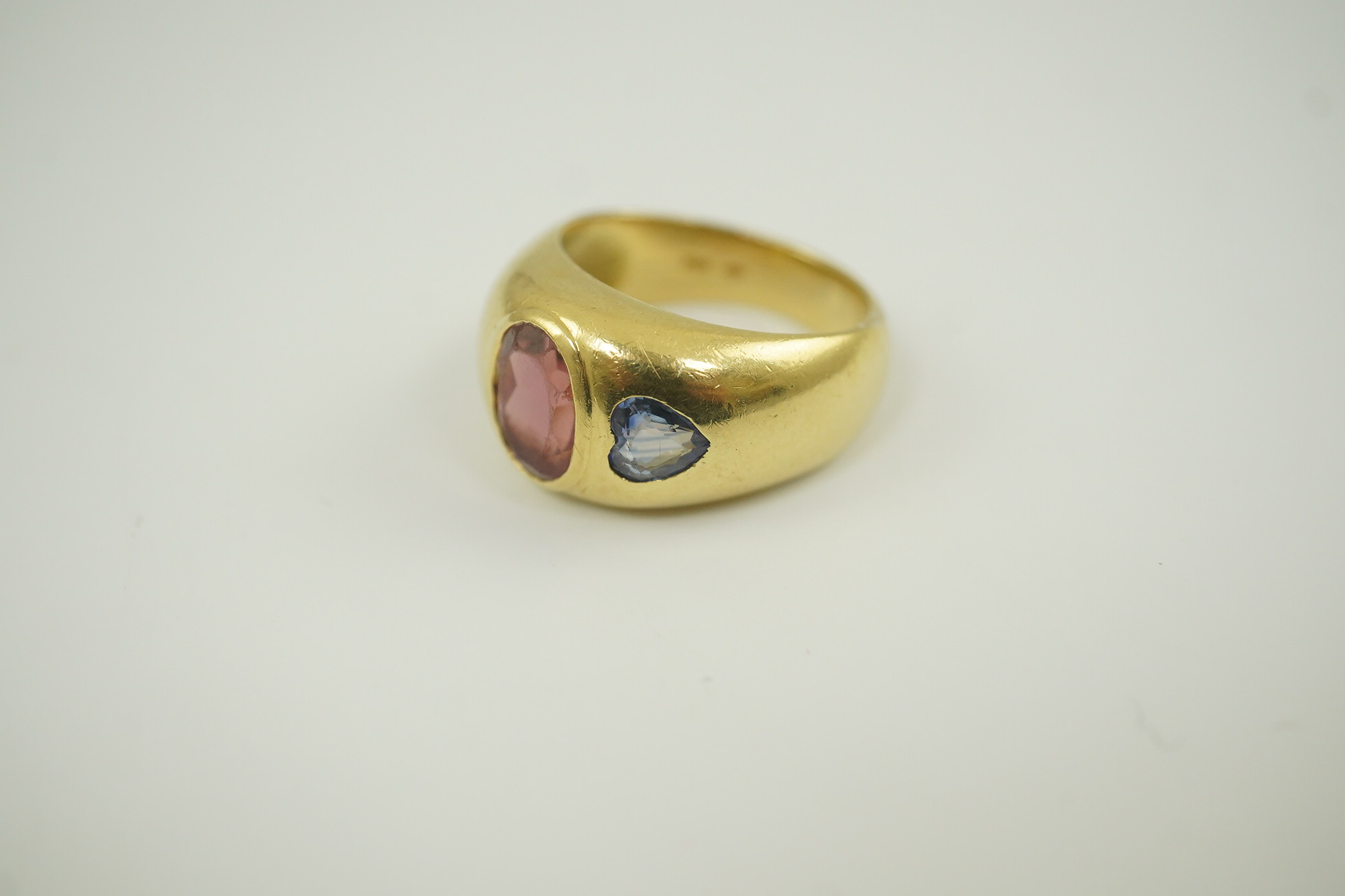 A modern Mappin & Webb 18ct gold and gypsy set pink tourmaline and blue sapphire set dress ring